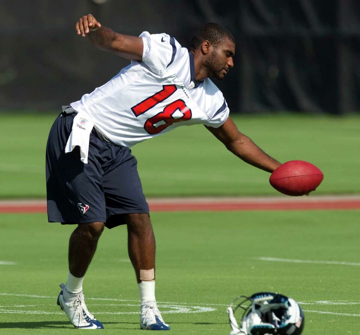 Houston Texans wide receiver Lestar Jean reaches out to catch a ball during Texans mini camp at the Methodist Training Center Thursday, June 14, 2012, in Houston.