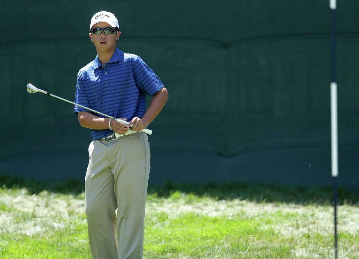 Andy Zhang watches his shot on the 11th hole during the second round of the U.S. Open Championship golf tournament Friday, June 15, 2012, at The Olympic Club in San Francisco. (AP Photo/Charlie Riedel)
