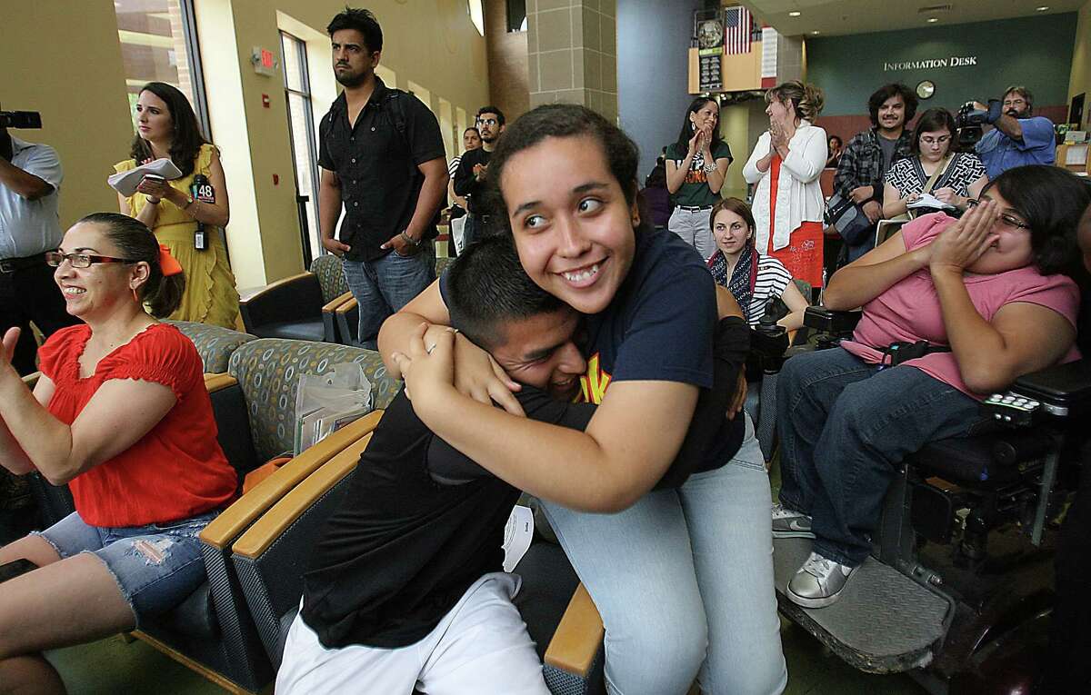 Maria Ibarra,19, originally from Durango Mexico and Candido Renteria, 24, of Monterrey Nuevo Leon, hug with joy after President Obama announced he would ease enforcement of immigration laws, Friday, June 15, 2012 in Edinburg, Texas. Many students gathered at the student union at the UTPA Campus in Edinburg to watch the annoucement.