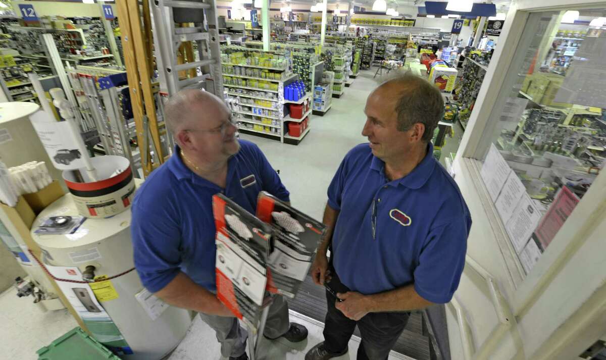 Dan Kays, store manager, left speaks with Dave Paris, corporate vice president at the Carr Hardware store in Watervliet, N.Y. June 15, 2012. Carr Hardware is closing this store. (Skip Dickstein/Times Union).