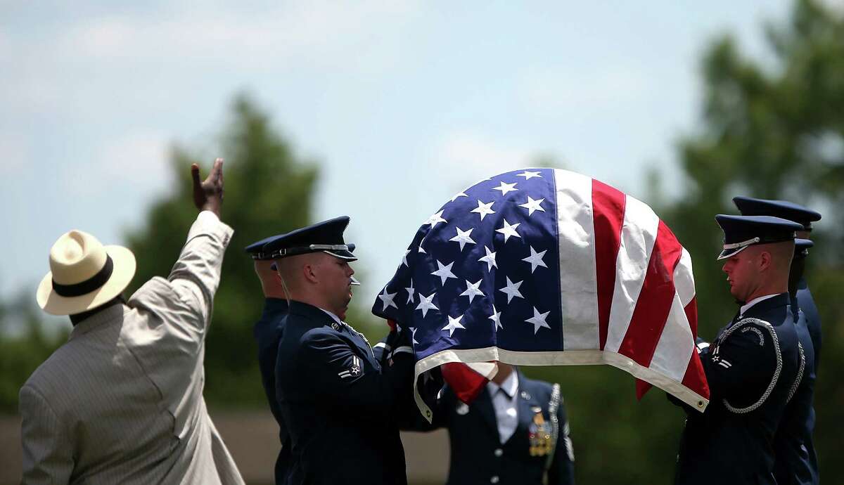 An Air Force honor guard team carries the casket of U.S. Air Force Lt. Col. Charles M. Walling, during his burial service June 15, 2012 at Arlington National Cemetery in Arlington, Virginia. Walling, of Phoenix, Arizona, crashed August 8, 1966 during a mission over Song Be Province, Vietnam. His remains were located in 2010.