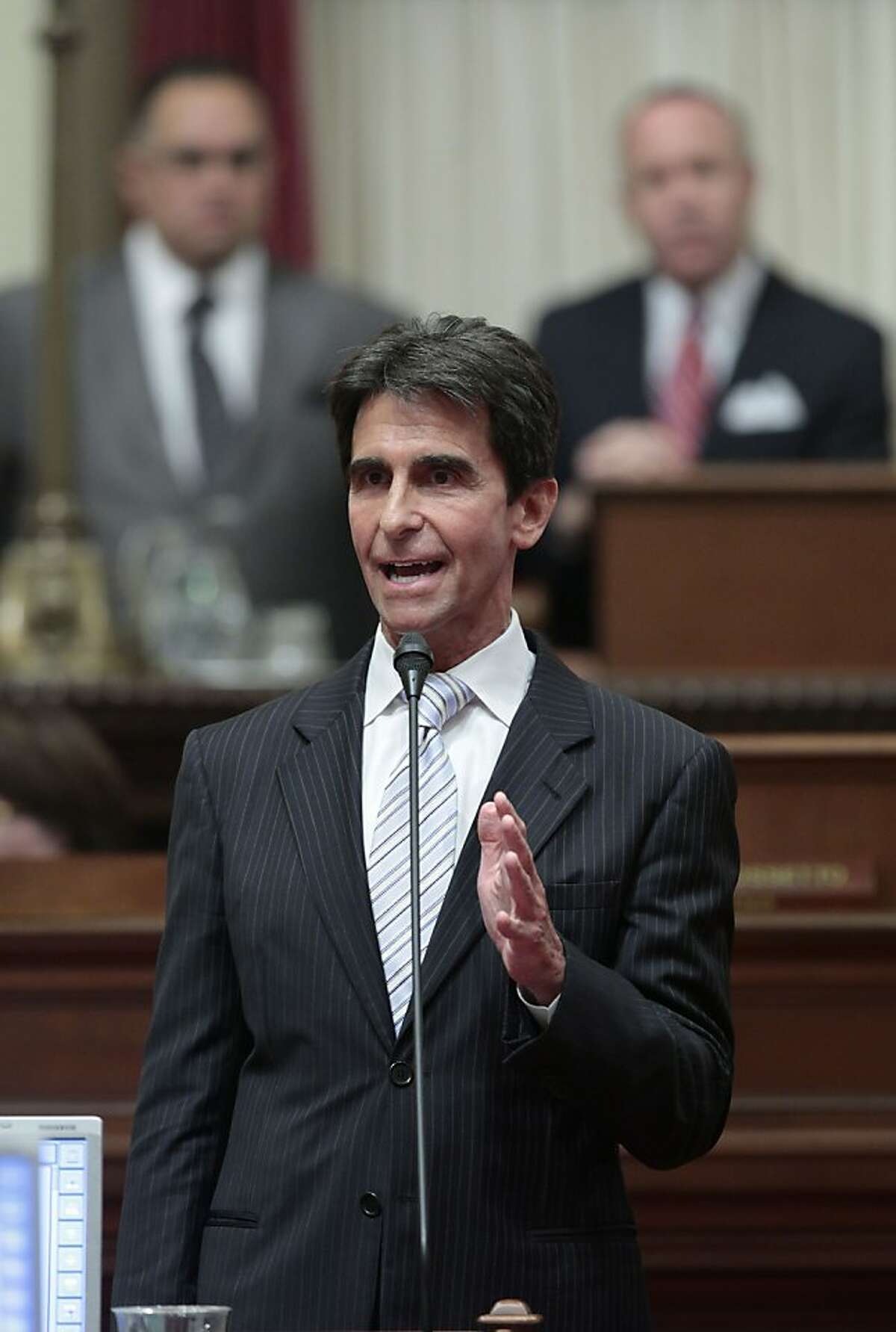 State Senate Budget Committee chairman Mark Leno, center, urges lawmakers to approve the 2012-13 state budget at the state Capitol in Sacramento, Calif., Friday, June 15, 2012. The Senate approved the budget plan by a 23-16 vote. The budget was later approved by the Assembly, 50-25 and sent to the governor. (AP Photo/Rich Pedroncelli)
