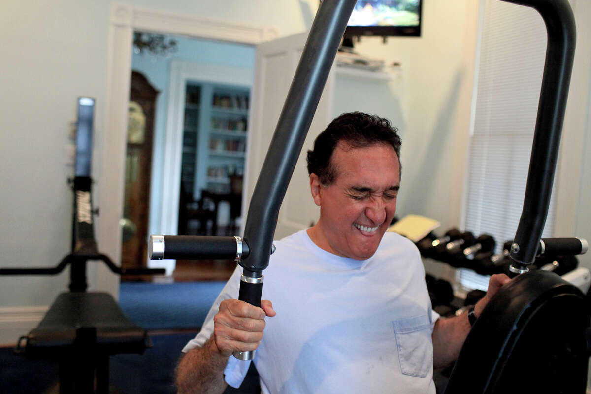 Henry Cisneros exercises at his home on Tuesday, June 12, 2012. He alternates cardio and weights to exercise most days of the week.