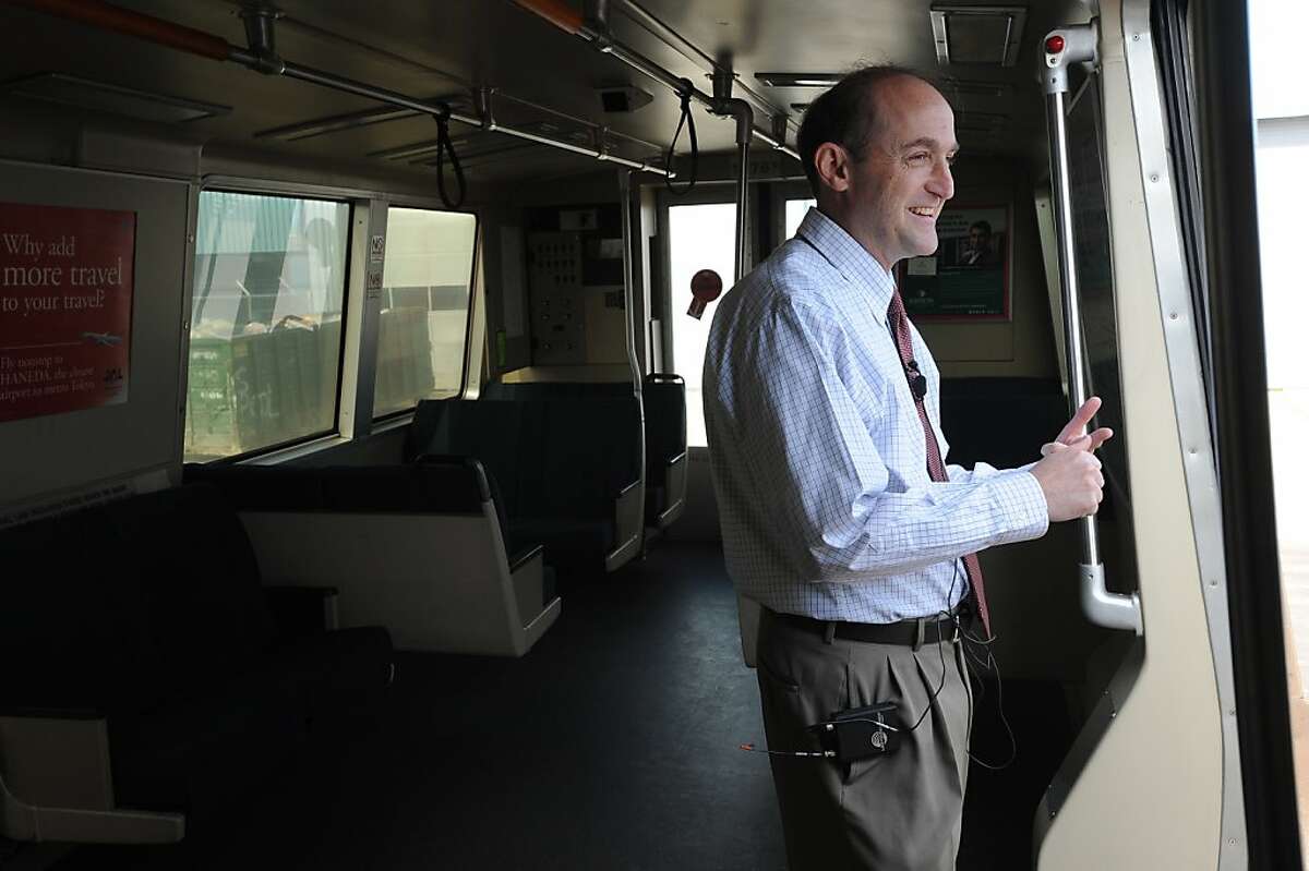 Bob Franklin, President of the Board of Directors, talks to the media in a BART train during a media availability at the BART Hayward Maintenance Complex in March 2011.
