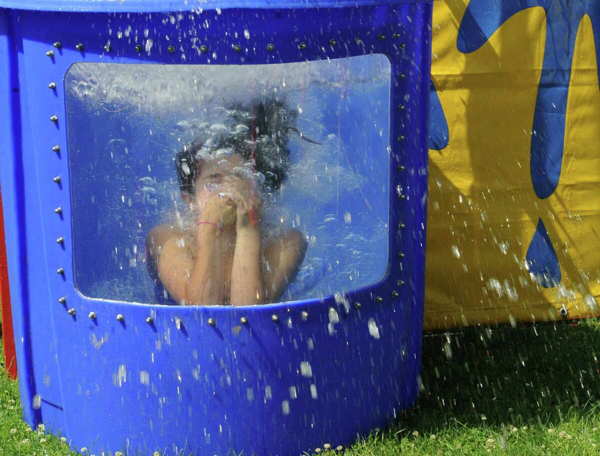 Mirella Rojas, 15, in a water game at the Greenwich Family Fair in Byram Park hosted by Junior League of Greenwich Sunday, June 17, 2012. In cooperation with the town, the Junior League is working to build a new community pool in Byram Park.