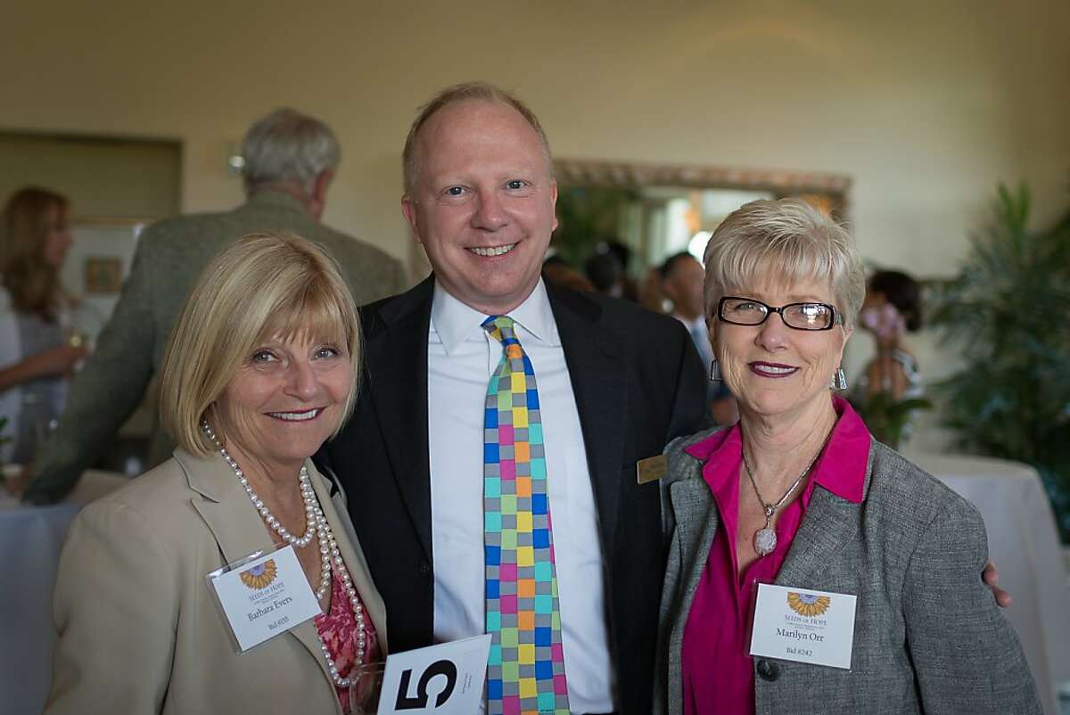 Community Overcoming Relationship Abuse, or CORA, held its annual fundraising gala on May 10, 2012, at the Menlo Circus Club in Atherton. The nonprofit is the sole agency in San Mateo County serving people who are physically, emotionally and mentally abused by their partners, and offers shelters for victims to escape abuse. From left to right: Barbara Evers, Borel Private Bank & Trust (event sponsor); Michael O'Donahue, CORA Development Director; and Marilyn Orr, Borel Private Bank & Trust (event sponsor).