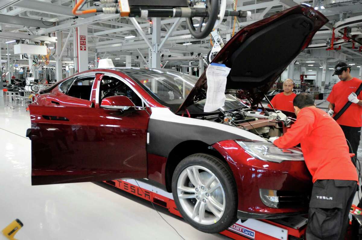 A Model S sedan is built at Tesla’s Fremont factory in 2012. The company repaid its loan early.