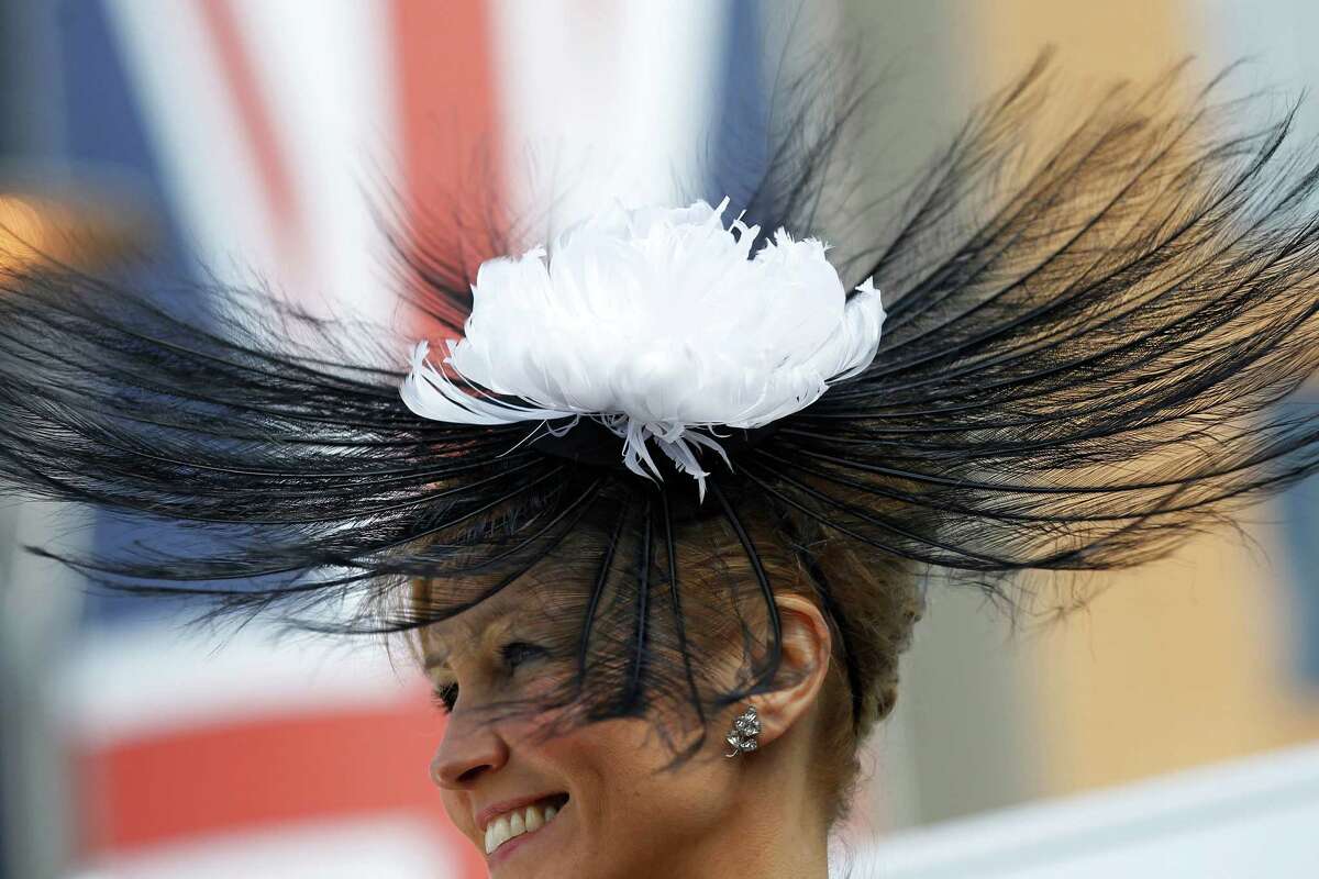 A race goer arrives on the first day of the Royal Ascot horse race meeting in Ascot, England, Tuesday, June 19, 2012. (AP Photo/Sang Tan)