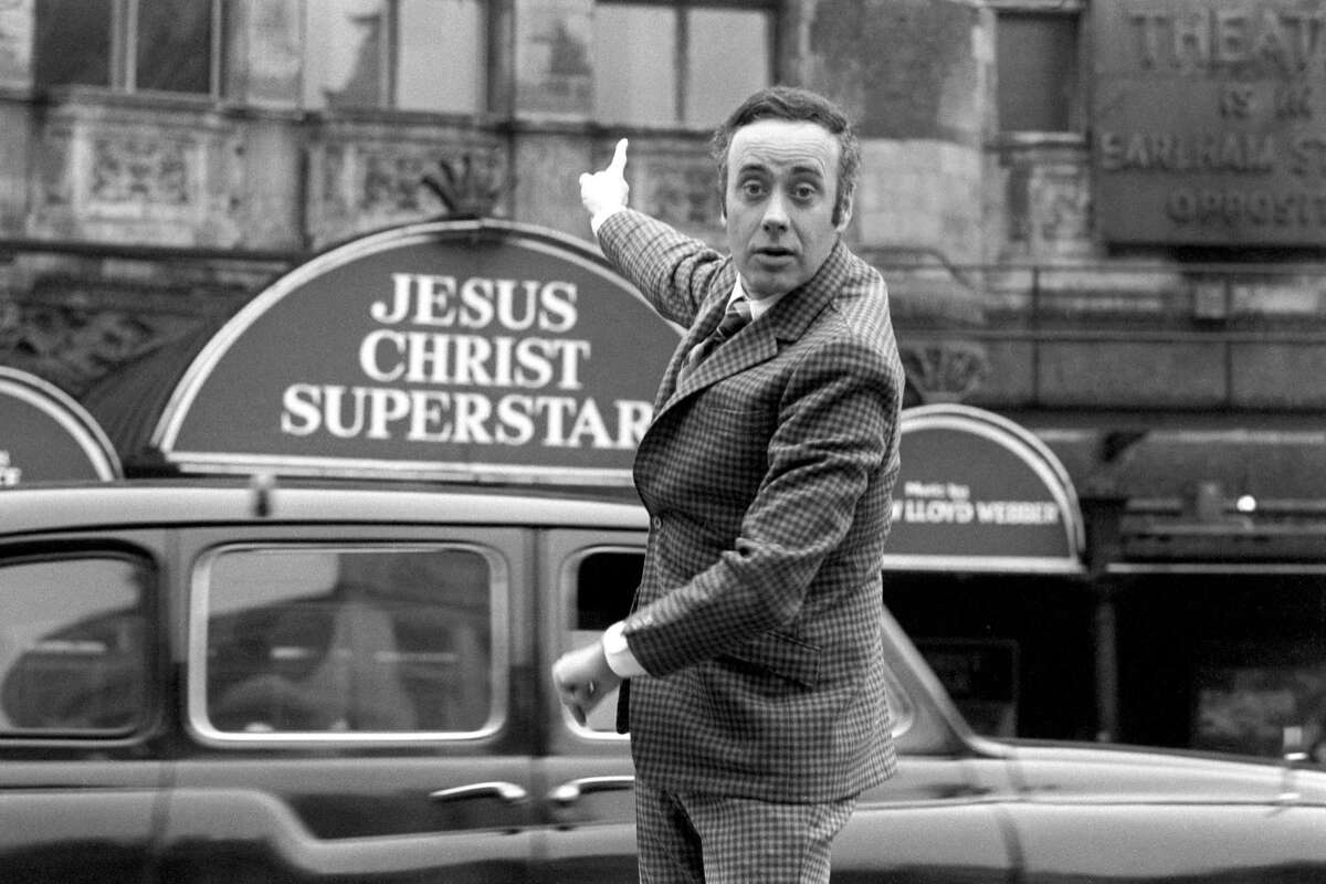 In this file photo of Nov. 2, 1972 Victor Spinetti poses outside the Palace Theatre, Cambridge Circus, London. Victor Spinetti, a comic actor who appeared in three Beatles movies and won a Tony on Broadway, has died, his agent said Tuesday June 19, 2012. He was 82. Spinetti died Tuesday morning June 19, 2012 after suffering from cancer for several years, said Barry Burnett, the actor's close friend and agent. Spinetti won a Tony award in 1965 for his Broadway performance in "Oh, What a Lovely War," but became most well-known for his appearances in the Beatles movies "A Hard Day's Night," ''Help," and "Magical Mystery Tour." (AP Photo/ PA Wire)