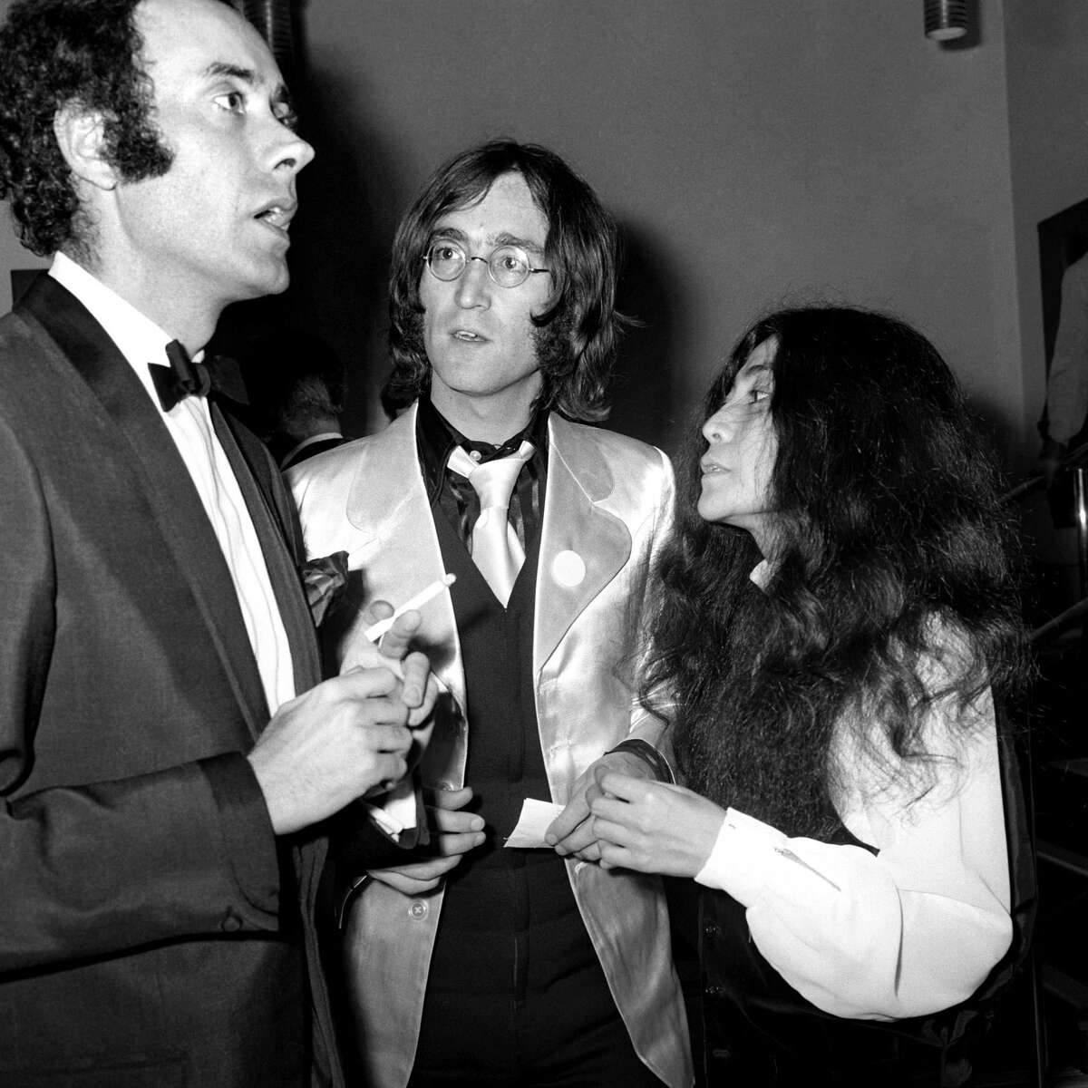 In this file photo of June 18, 1968 Victor Spinetti talks with John Lennon and Yoko Ono in London. Victor Spinetti, a comic actor who appeared in three Beatles movies and won a Tony on Broadway, has died, his agent said Tuesday June 19, 2012. He was 82. Spinetti died Tuesday morning June 19, 2012 after suffering from cancer for several years, said Barry Burnett, the actor's close friend and agent. Spinetti won a Tony award in 1965 for his Broadway performance in "Oh, What a Lovely War," but became most well-known for his appearances in the Beatles movies "A Hard Day's Night," ''Help," and "Magical Mystery Tour." (AP Photo/ PA Wire)