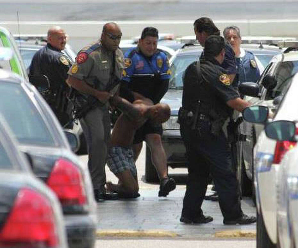 Demond Bluntson is detained after police said he fatally shot an infant and critically injured a 6-year-old in the Holiday Inn-Civic Center in Laredo on Tuesday, June 19, 2012.