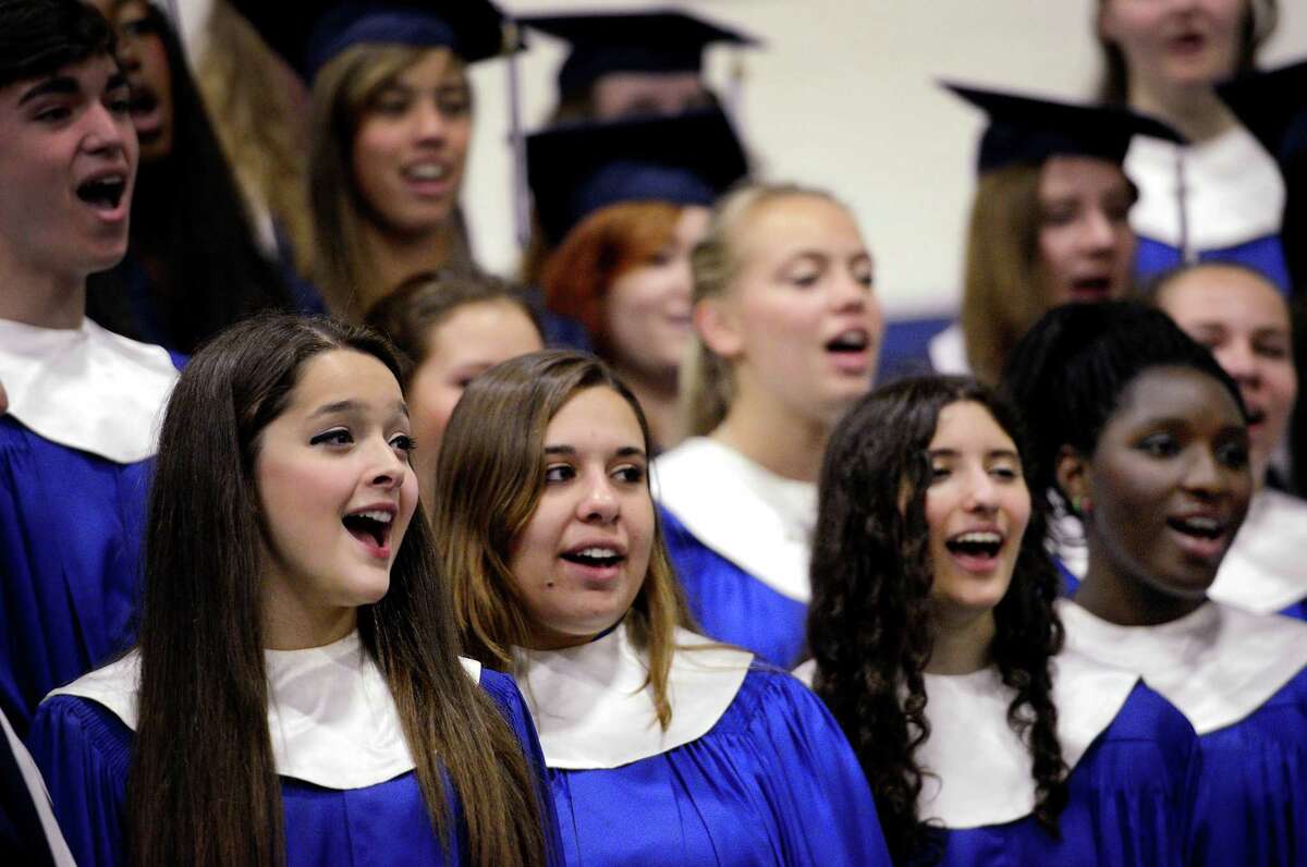 left to right front row; Grace McDonald-Scidner, Emily Nuzzo, Brianna Reedy, and Ashley Snow of the Staples High School choir sing the song "In My Life" during graduation ceremony at Staples High School, Westport, CT, Tuesday June 19th 2012