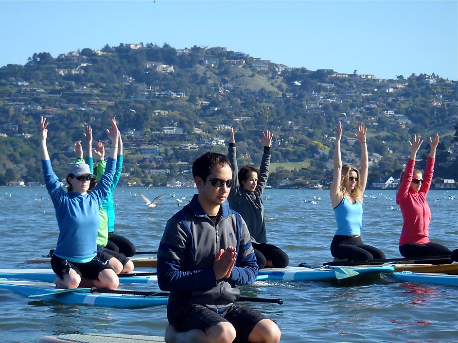 Standup paddle yoga classes on the bay