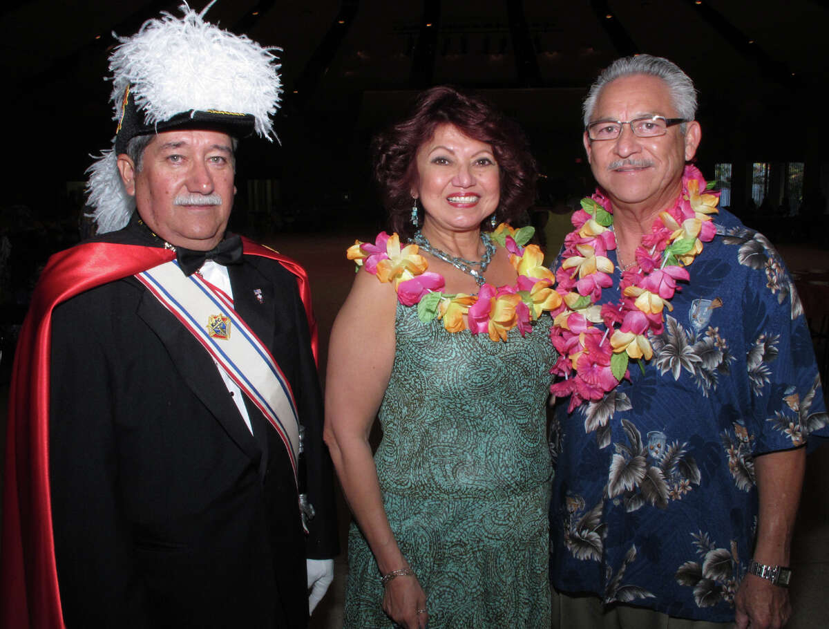 Knights of Columbus Council 7983 Summer Knights Hawaiian Dance: Guests Jose Martinez (from left) and Linda and husband Rafael Rodriguez, event chairman, get together during the dance at Villita Assembly Building.