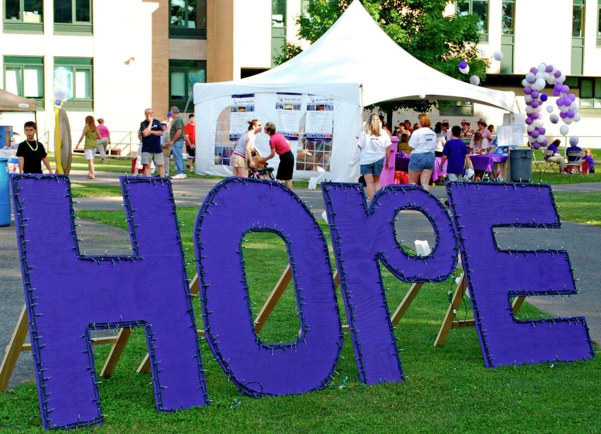 The ìHopeî sign ñ lit up at dusk ñ serves as inspiration for those in attendance at the New Milford Relay For Life, a benefit for the American Cancer Society, held June 16-17, 2012 at Sarah Noble Intermediate School in New Milford.