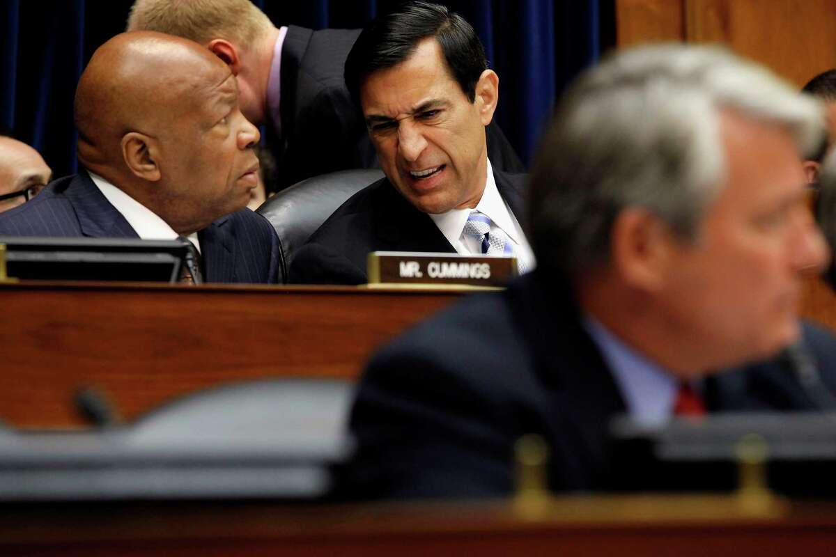 Darrell Issa, R-Calif. (center), talking to Elijah Cummings, D-Md., heads the House Oversight and Government Reform Committee, which voted 23-17 to hold Eric Holder in contempt.
