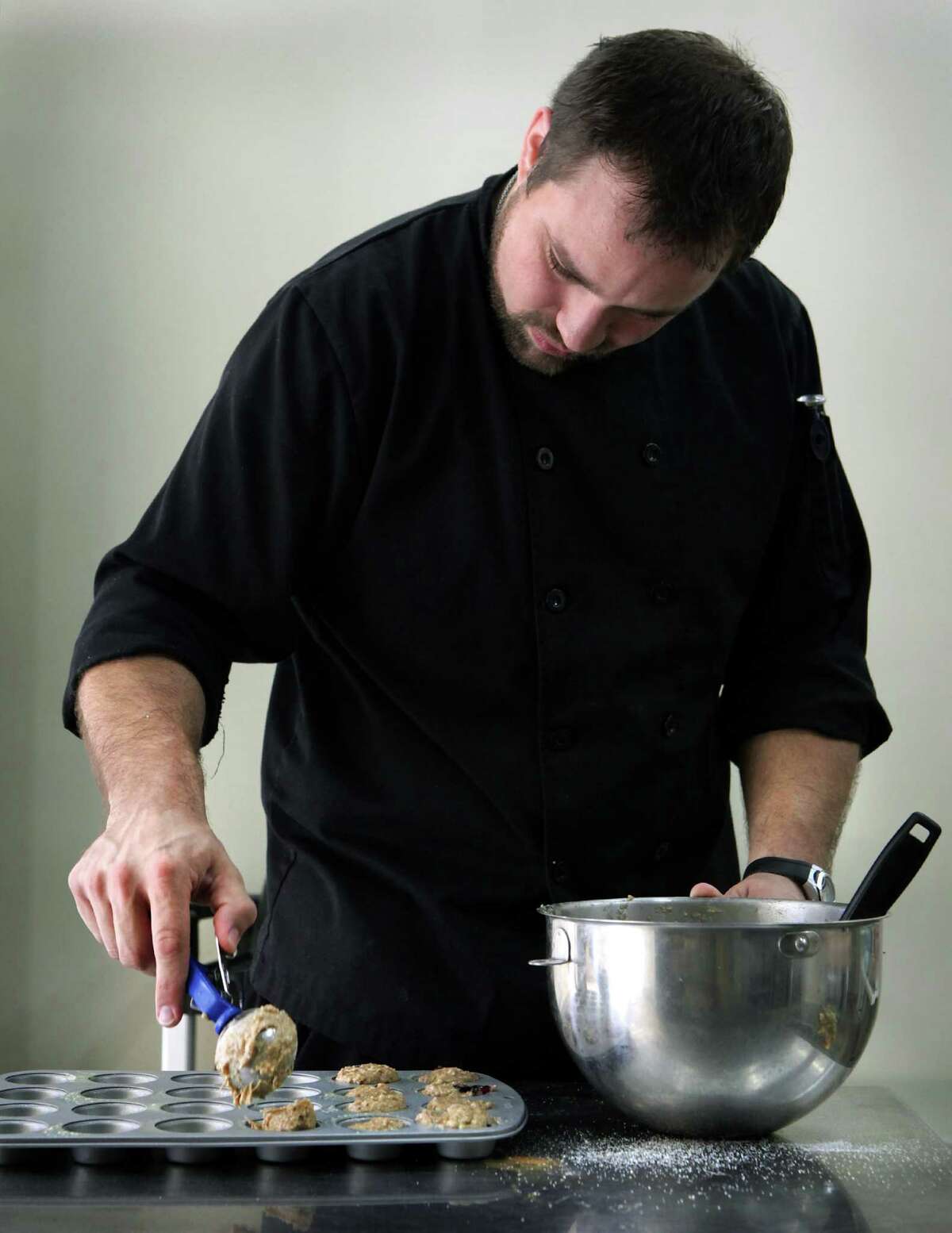 Keith Cruzan, Executive Chef at Bake Broil and Brew, has lost 70 lbs, having changed his diet to healthier foods. Cruzan is making Wheat Blueberry Muffins. Tuesday, June 14, 2012.