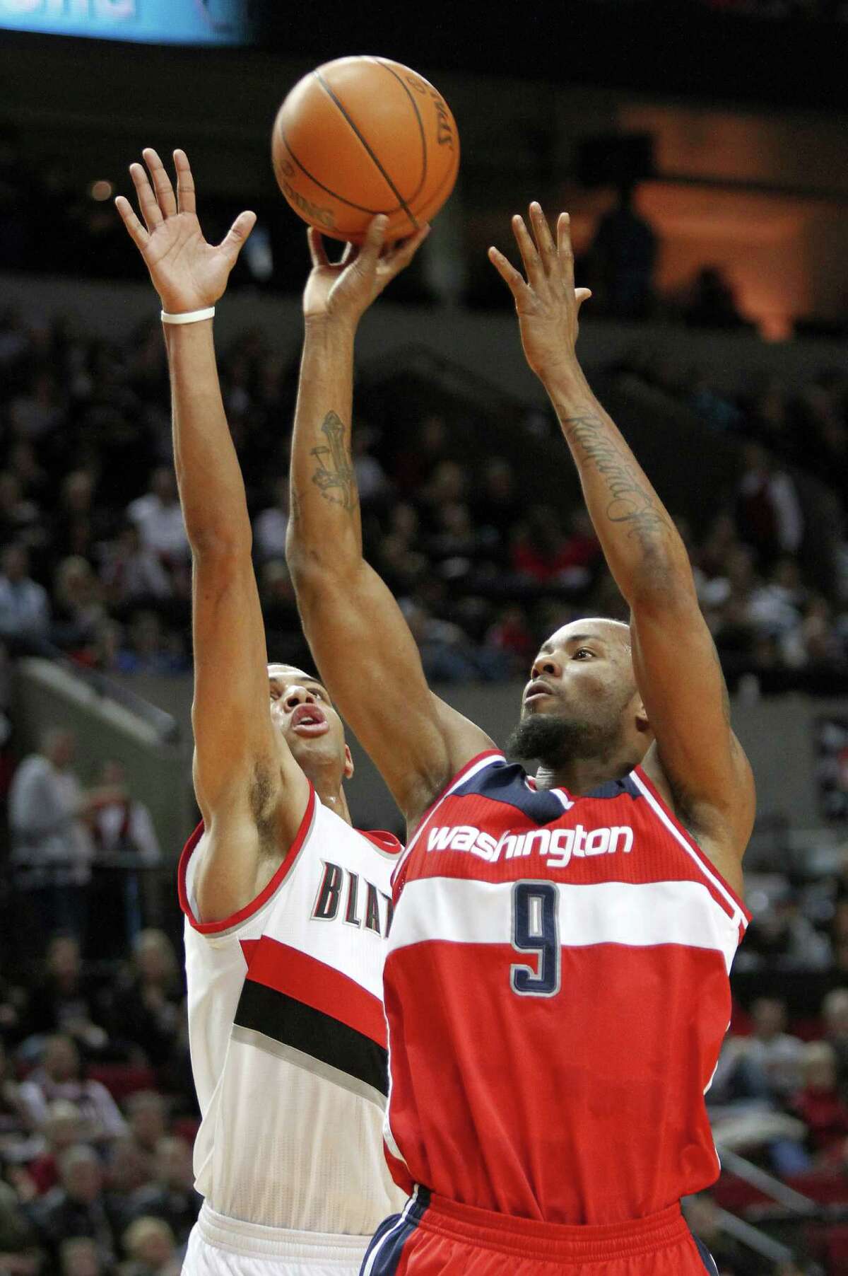 The Wizards saved themselves from spending $13.7 million in a buyout by instead trading Rashard Lewis (right) to the Hornets.
