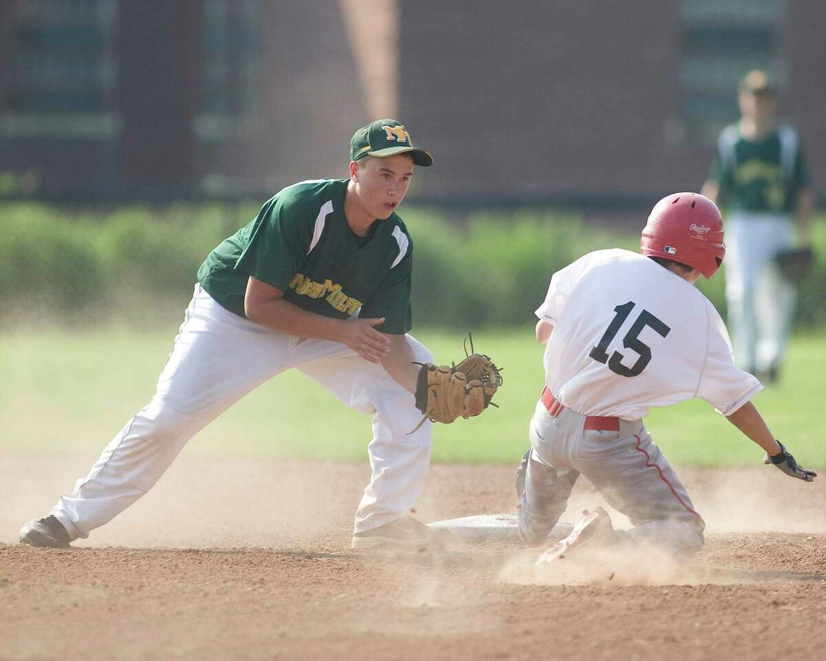 New Milford's Tyler Hansen tags out Pomperaug's Ben Kachur trying to steal second during the Jimmy Fund 13-year-old championship game Tuesday on the Fairfield Hills campus in Newtown.