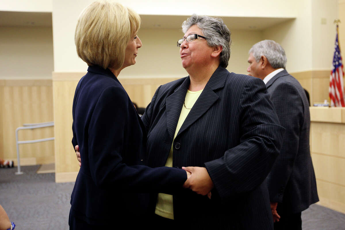 South San Antonio Independent School District Board Member Connie Prado, left, congratulates Rebecca Robinson during their regular meeting, Wednesday, June 20, 2012. Robinson was hired as the district's new superintendent during the meeting.