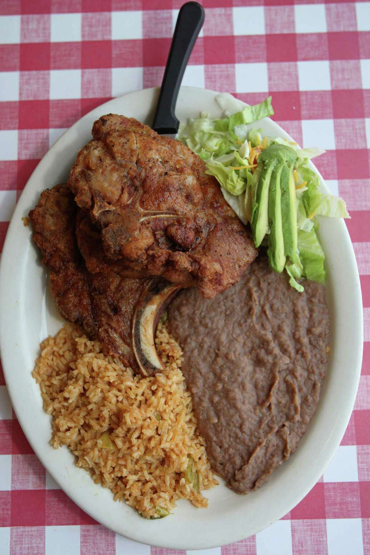 Pork chop taco combo plate with rice and beans is a popular dish at Angel's Mexican Haven Monday June 11, 2012.