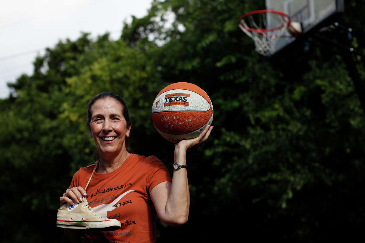 Ex-Bexar County judge Cyndi Taylor Krier, holding the shoes she wore in the state title basketball game for George West, says she used lessons learned from playing during her career.  Lisa Krantz / San Antonio Express-News
