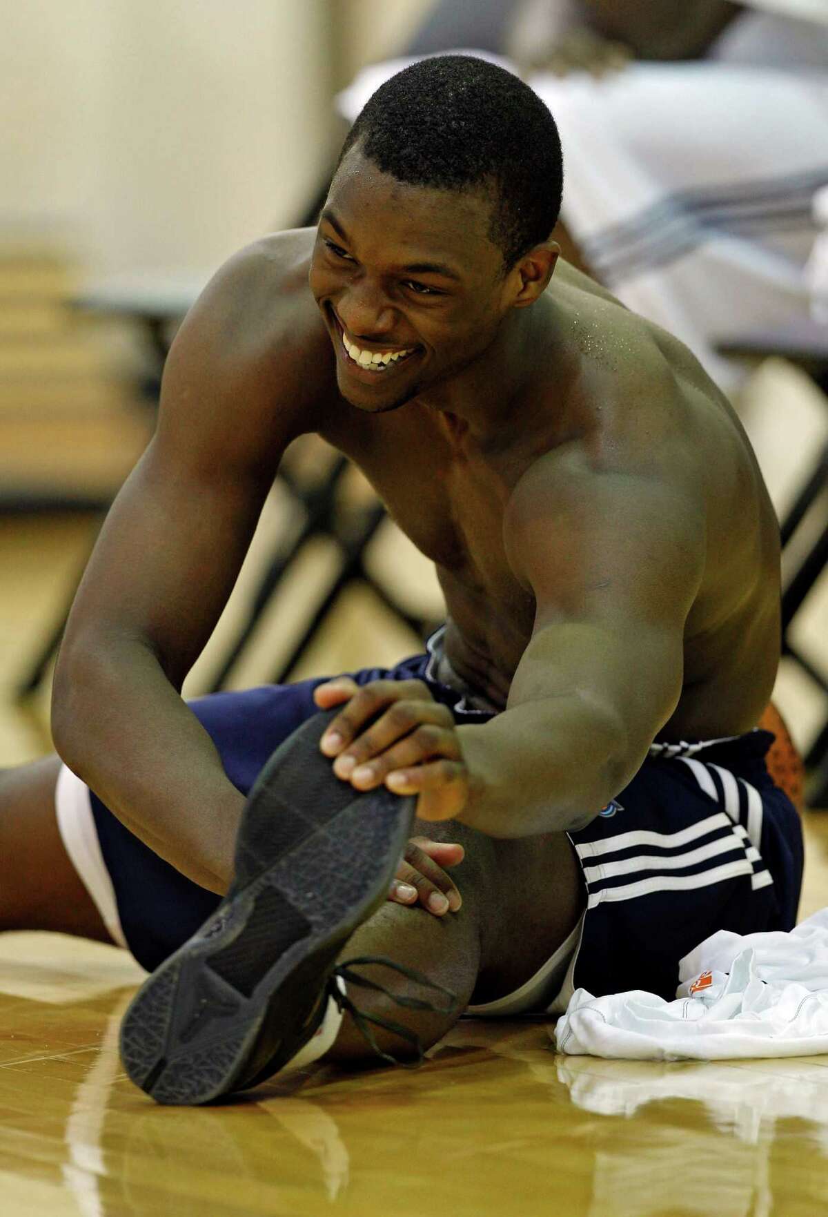 Harrison Barnes stretches after a pre-draft workout for the Charlotte Bobcats NBA basketball team in Charlotte, N.C., Thursday, June 21, 2012.