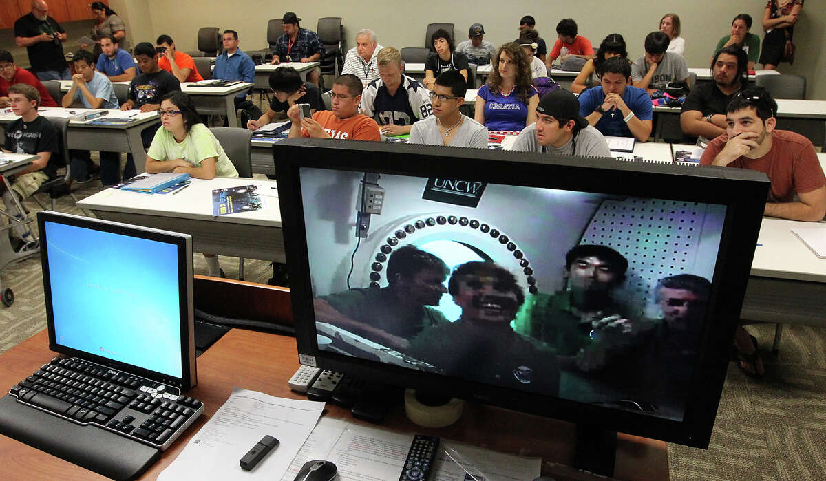 Students video conference with aquanauts of the NASA Extreme Environment Mission Operations (NEEMO) project at San Antonio College (SAC) on Thursday, June 21, 2012. Students from SAC's Early Development of General Engineering (EDGE) program asked questions of the aquanauts who are living in an underwater habitat off the southeast coast of Florida. NEEMO attempts to simulate the environments of deep space exploration. The goal of EDGE is to aid students in the development of interest in the field of engineering. The aquanauts are: Timothy Peake (from left), Dottie Metcalf-Lindenburger, Kimiya Yui and Steven Squyres. The video conferece lasted about 30 minutes.