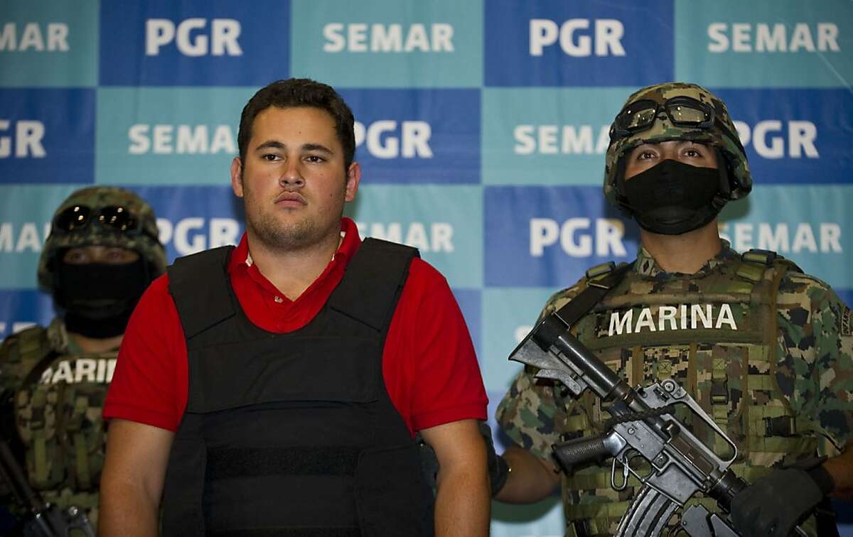 The son of Joaquin Guzman Loera, aka "El Chapo Guzman", leader of the Pacific drug cartels, Jesus Alfredo Guzman Salazar, is presented to the press in Mexico City, on June 21, 2012. Guzman Salazar was arrested by the Mexican marines on Thursday in an operation in Zapopan, Jalisco State. AFP PHOTO/RONALDO SCHEMIDTRonaldo Schemidt/AFP/GettyImages