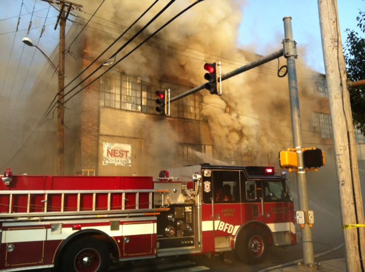 Firefighters respond to a "major fire" in an old factory building at Railroad and Hancock avenues on Thursday, June 21, 2011.