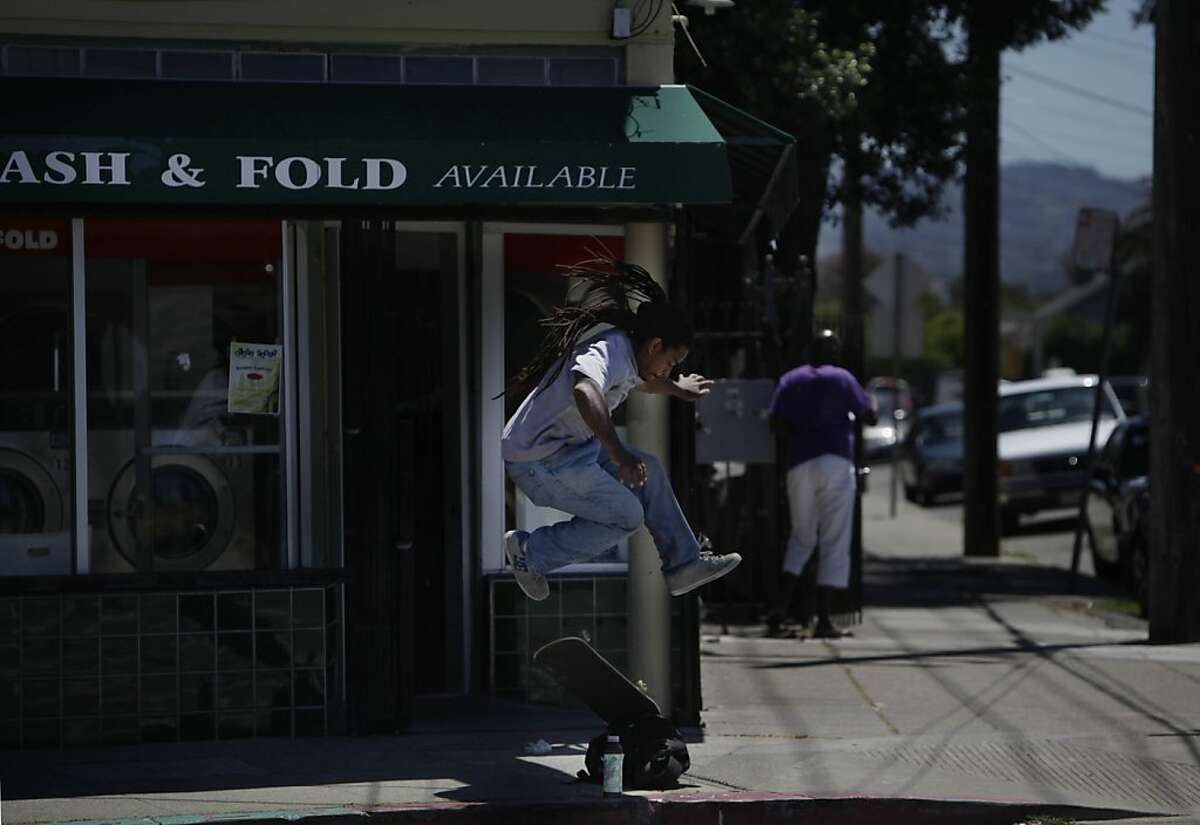 Samuel Carter of Oakland practices his skateboarding as he waits for his laundry to be finished at the corner of Market and 45th Street on Friday, June 8, 2012 in Oakland, Calif.