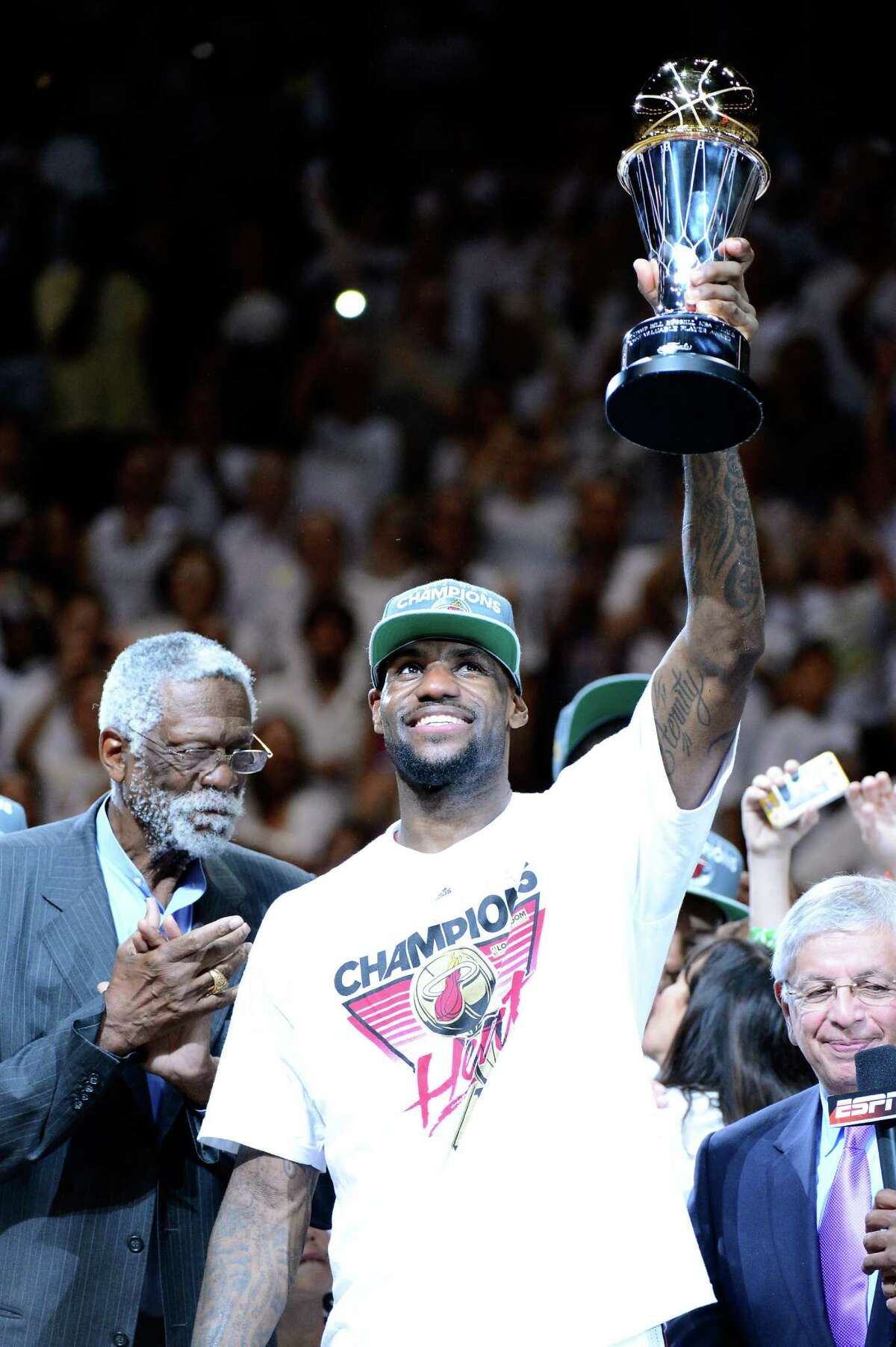 LeBron James of the Miami Heat celebrates with the Bill Russell Finals MVP trophy after they won 121-106 against the Oklahoma City Thunder.
