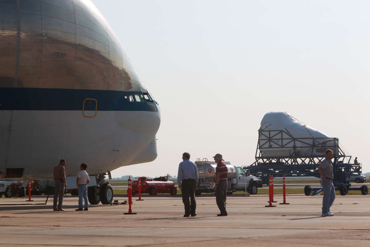 The NASA Super Guppy cargo plane prepares Friday morning to move the nose section of the full fuselage trainer cockpit used to train astronauts for space shuttle flights from Ellington International Airport in Houston to the Museum of Flight in Seattle, where it will go on display.