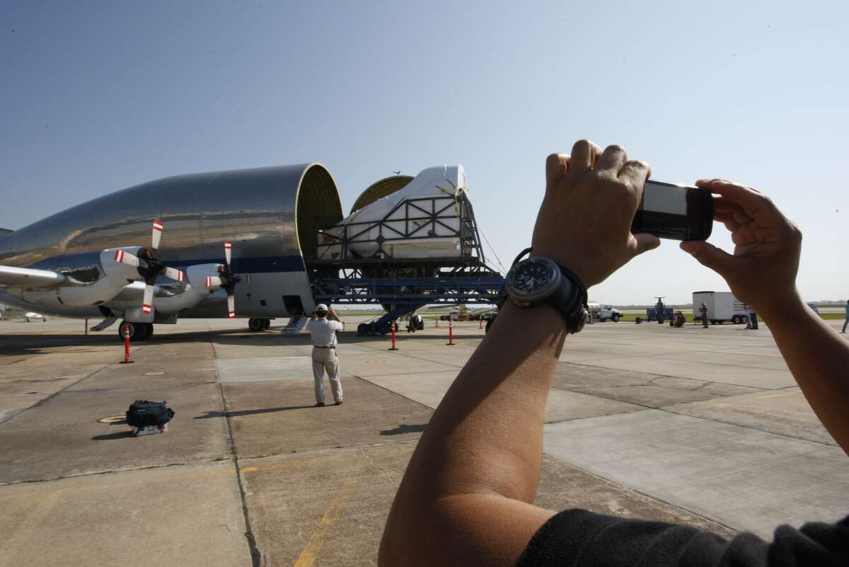 The nose section of the full fuselage trainer cockpit used to train astronauts for space shuttle flights is moved into the NASA Super Guppy cargo plane Friday morning at Ellington International Airport in Houston. It will be moved to the Museum of Flight in Seattle, where it will go on display.