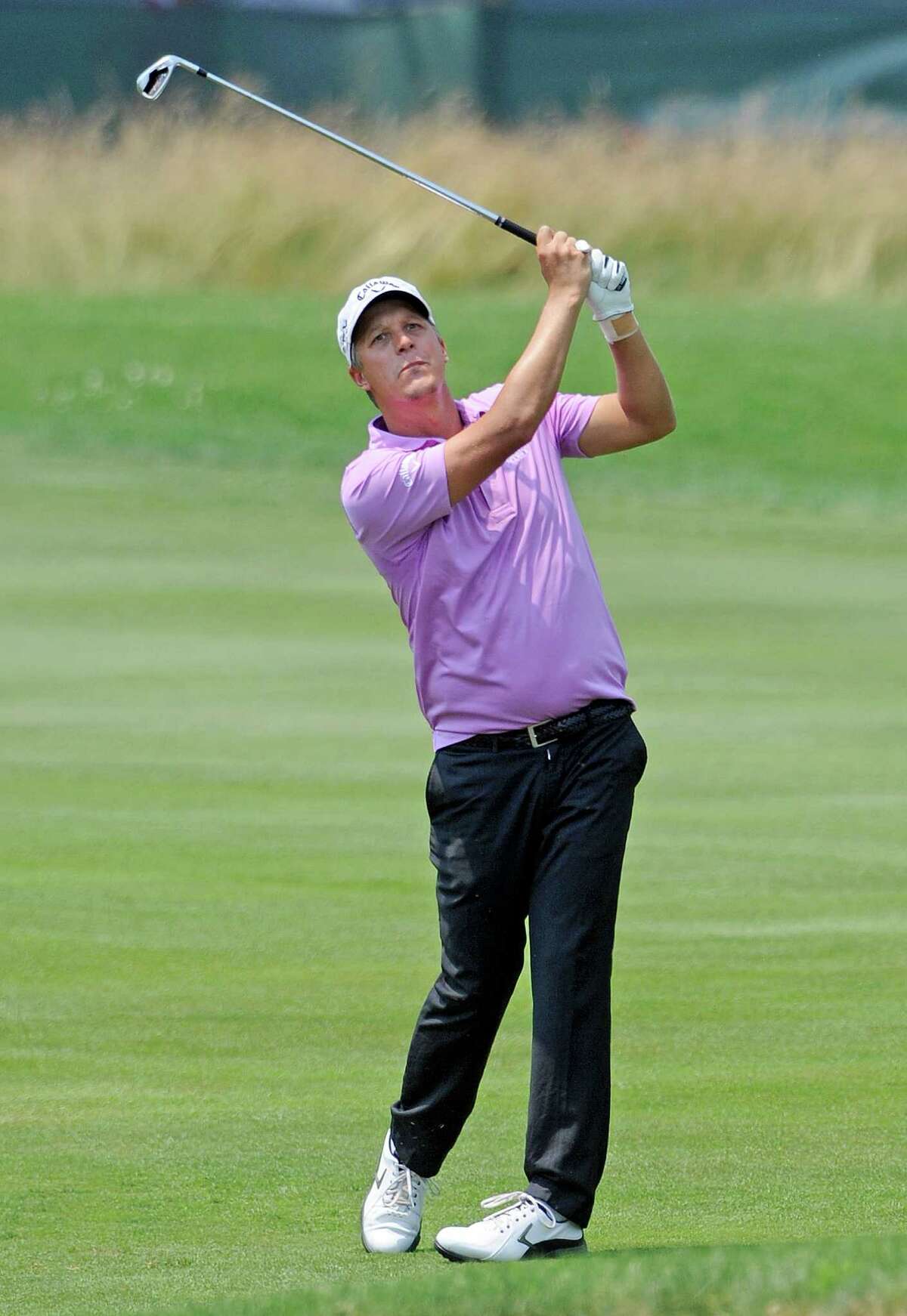 Frederik Jacobsen, of Sweden, watches his approach shot on the ninth hole during the second round of the Travelers Championship golf tournament in Cromwell, Conn., Friday, June 22, 2012. Jacobsen finish with a two-day score of 9-under-par. (AP Photo/Fred Beckham)