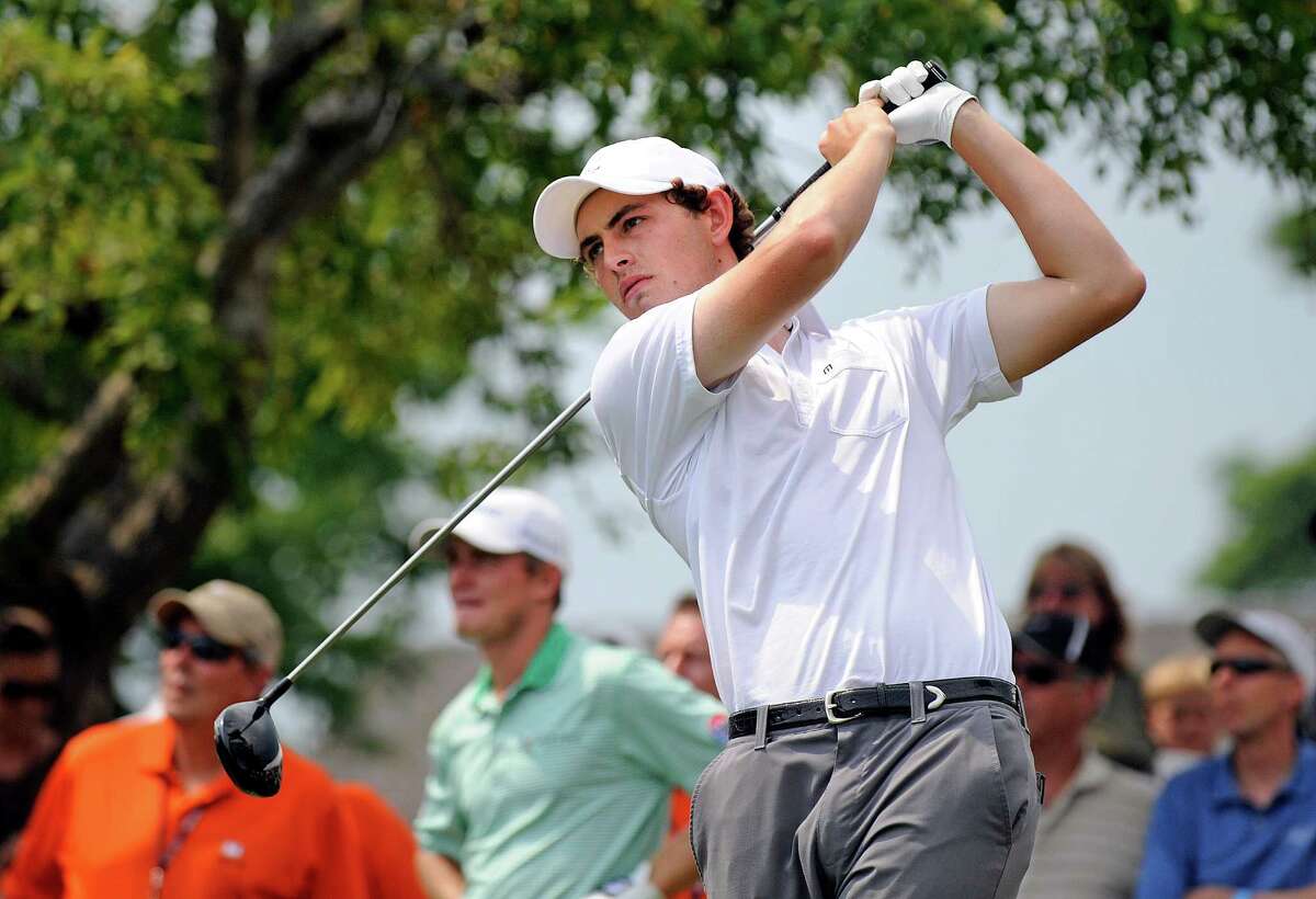 Patrick Cantlay watches his drive as a crowd looks on at the first hole hole during the second round of the Travelers Championship golf tournament in Cromwell, Conn., Friday, June 22, 2012. (AP Photo/Fred Beckham)