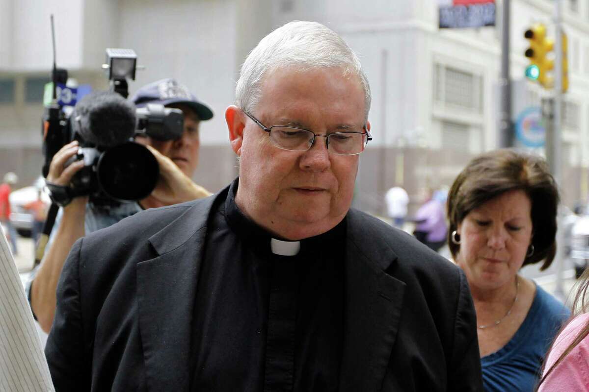 Monsignor William Lynn walks to the courthouse Friday in Philadelphia, where he was on trial for allegedly helping the archdiocese cover up child sex abuse claims.