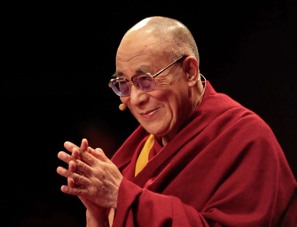 LONDON, ENGLAND - JUNE 19: His Holiness the Dalai Lama, 76, appears at Royal Albert Hall on June 19, 2012 in London, England. The exiled Buddhist Tibetan leader is on national tour of the United Kingdom with visits to Manchester, Leeds and London. (Photo by Rosie Hallam/Getty Images)