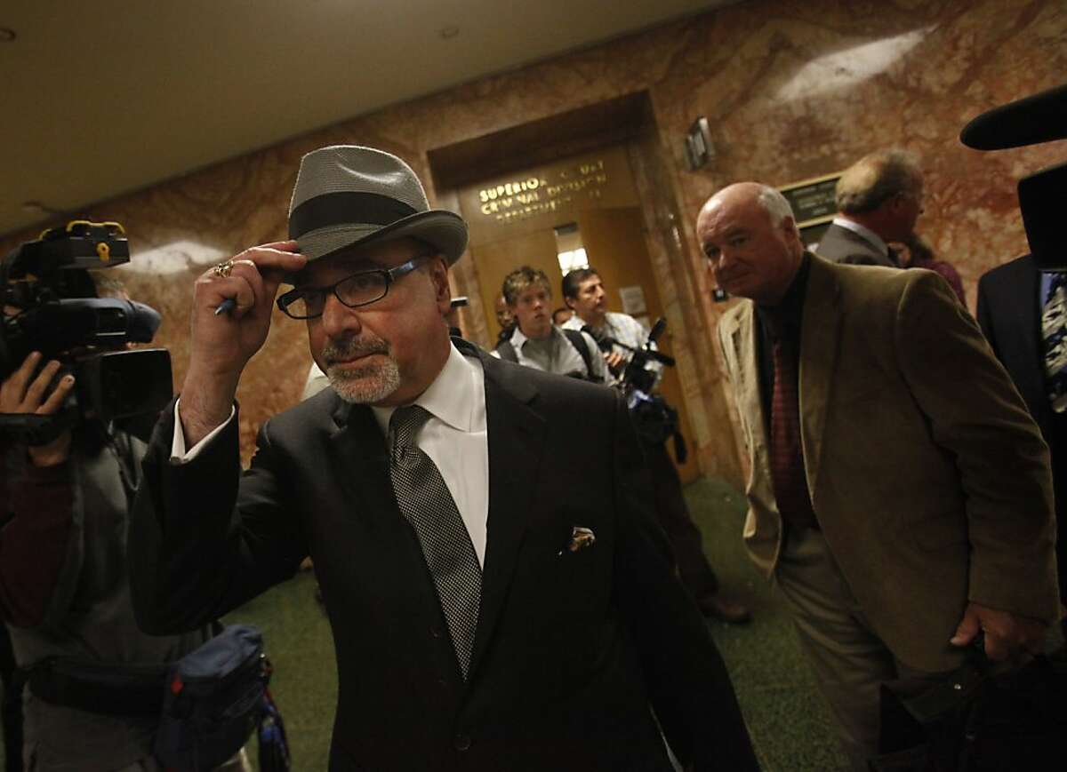 Attorney Eric Safire, attorney for Barry Gilton, dons his hat after leaving Department 11 after Lupe Mercado and Barry Gilton pleaded not guilty to murder charges at the Hall of Justice on Friday, June 22, 2012 in San Francisco, Calif. Gilton and Mercado are accused of killing Calvin Sneed, a man they believe was their daughter's pimp.