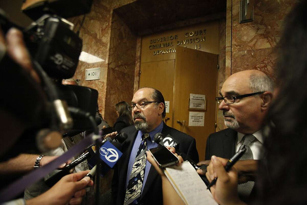 Attorneys Tony Tamburello (l to r) and Eric Safire talk with the media outside Department 11 after their clients, Lupe Mercado and Barry Gilton, pleaded not guilty to murder charges at the Hall of Justice on Friday, June 22, 2012 in San Francisco, Calif. Gilton and Mercado are accused of killing Calvin Sneed, a man they believe was their daughter's pimp.