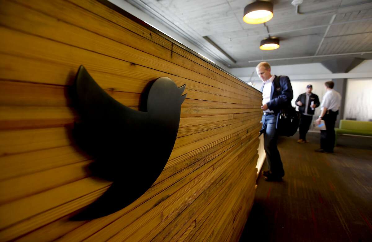 The reception desk, made from the wooden planks of the lanes of a bowling alley, greets vistors inside the lobby area, on Thursday June 21, 2012, as social networking company Twitter has finished moving into the historic Market Square building at 1355 Market St. in San Francisco, Ca.
