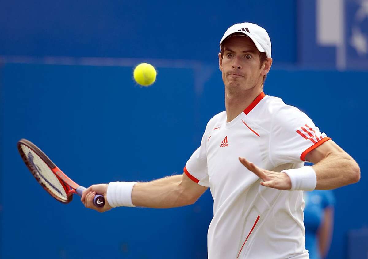 Britain's Andy Murray eyes the ball as he prepares to return it against France's Nicolas Mahut during the Men's single 2nd Round on the third day of the Aegon Championships tennis tournament at the Queen's Club in west London on June 13, 2012. AFP PHOTO / MIGUEL MEDINAMIGUEL MEDINA/AFP/GettyImages