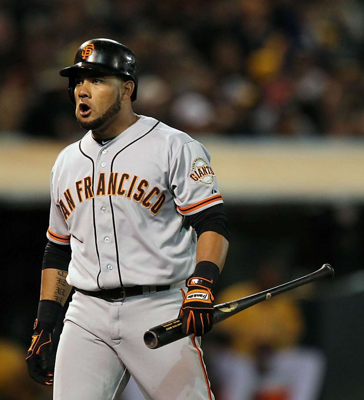 San Francisco Giants Melky Cabrera turns to the Giants dugout and voices his displeasure after striking out in the 8th inning against the Oakland Athletics during their MLB Baseball Game on Friday June 22, 2012 at the Oakland Coliseum, in Oakland California.