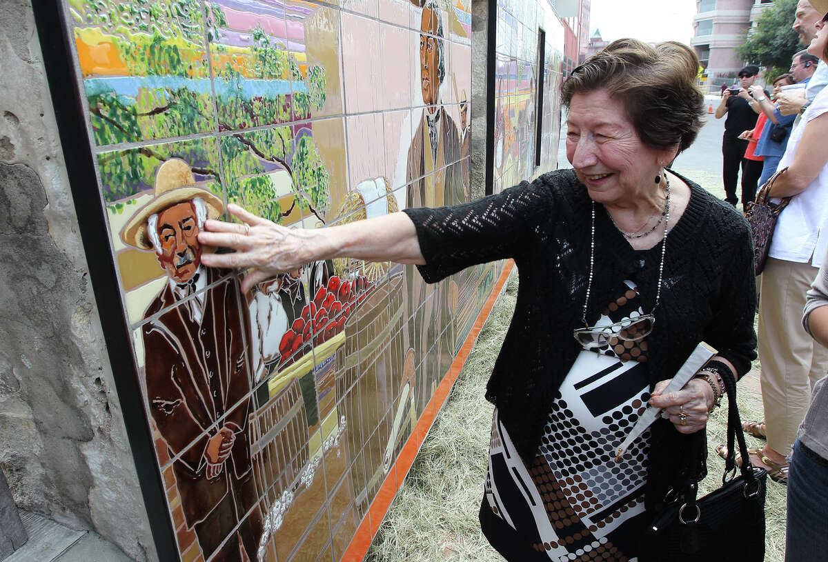 Patrina Rodriguez brushes her hand against a mural which has the likeness of her husband, Ruben, after the mural's unveiling ceremony at Casa Navarro State Historic Site on Saturday, June 23, 2012. The mural was created by Jesse Trevino and his wife Elizabeth Rodriguez. Elizabeth Rodriguez is the niece to Patrina and Ruben Rodriguez and used the likeness of her uncle as well as other family members to depict the people in the mural. The Texas Historical Commission, Friends of Casa Navarro and the Cortez Family unveiled the mural which was created by artists Trevino and Rodriguez in honor of Jose Antonio Navarro. The mural depicts life in historic San Antonio. Ruben Rodriguez had passed away last year.