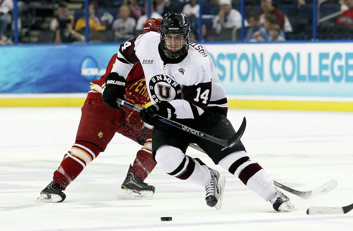 TAMPA, FL - APRIL 05: Defenseman Shayne Gostisbehere #14 of the Union College Dutchman advances the puck against the Ferris State Bulldogs during the NCAA Division 1 Men's Hockey Championship Semifinal Game at the Tampa Bay Times Forum on April 5, 2012 in Tampa, Florida. (Photo by J. Meric/Getty Images)