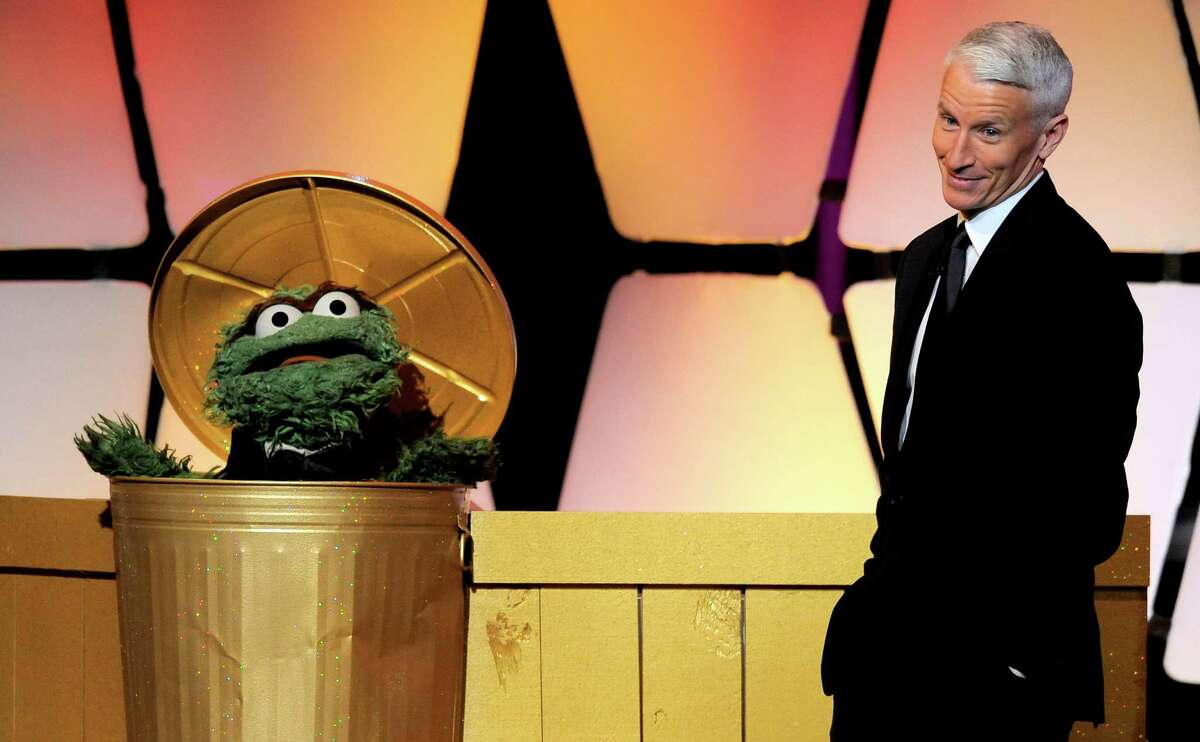 The character Oscar the Grouch, left, and Anderson Cooper appear onstage at the 39th annual Daytime Emmy Awards at the Beverly Hilton Hotel in Beverly Hills, Calif., on Saturday, June 23, 2012.