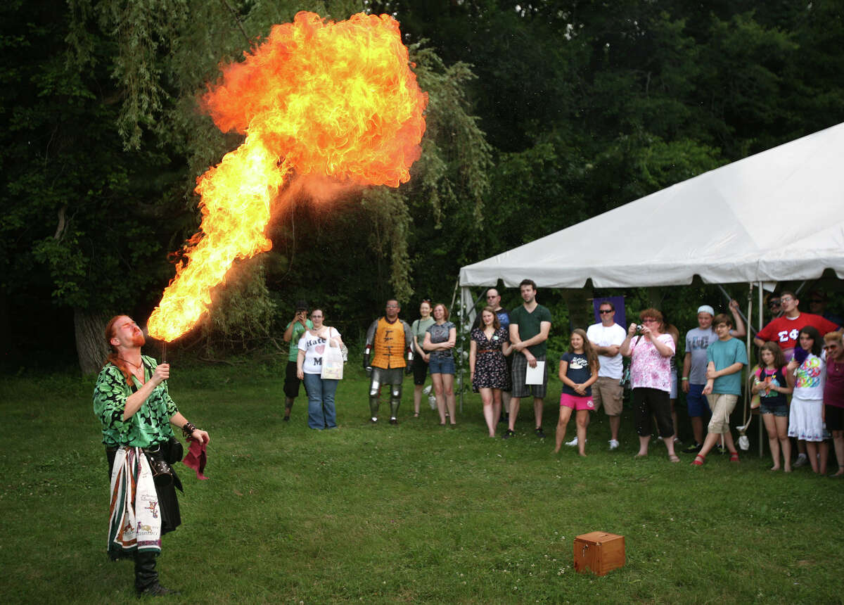 Magician and fair general manager Daniel GreenWolf of Ansonia displays his fire breathing skills at the Midsummer Fantasy Renaissance Faire at Warsaw Park in Ansonia on Sunday, June 24, 2012. The fair runs the following two weekends, June 30 to July 1, and July 7-8.