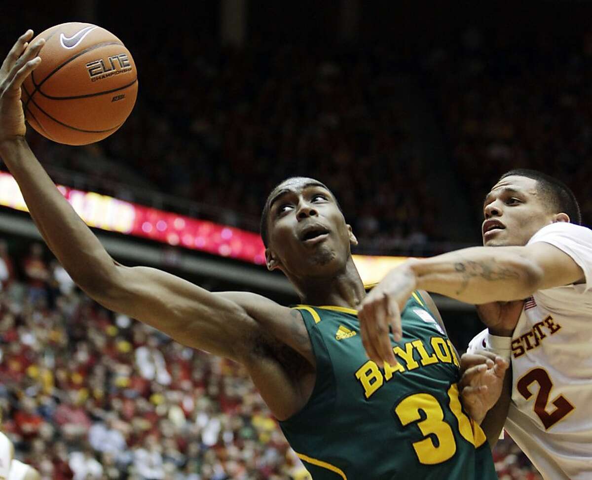 Baylor forward Quincy Miller, left, catches a pass over Iowa State guard Chris Babb, right, during the first half of an NCAA college basketball game, Saturday, March 3, 2012, in Ames, Iowa. (AP Photo/Charlie Neibergall)