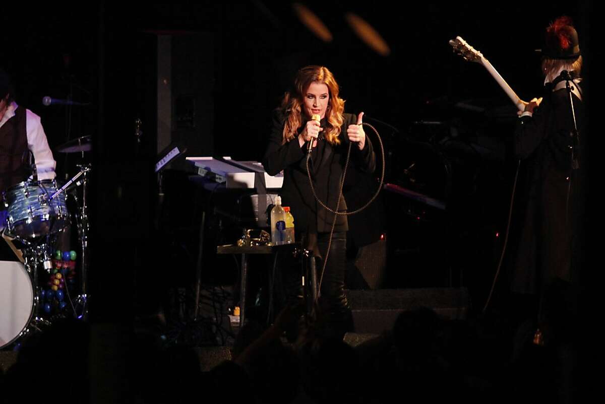 Lisa Marie Presley gives a thumbs up to fans yelling "I love you" at Slim's in San Francisco Calif. on Sunday, June 24, 2012. Presley's third album 'Storm and Grace' was released May 15, approximately nine years after her first album 'To Whom It May Concern.'