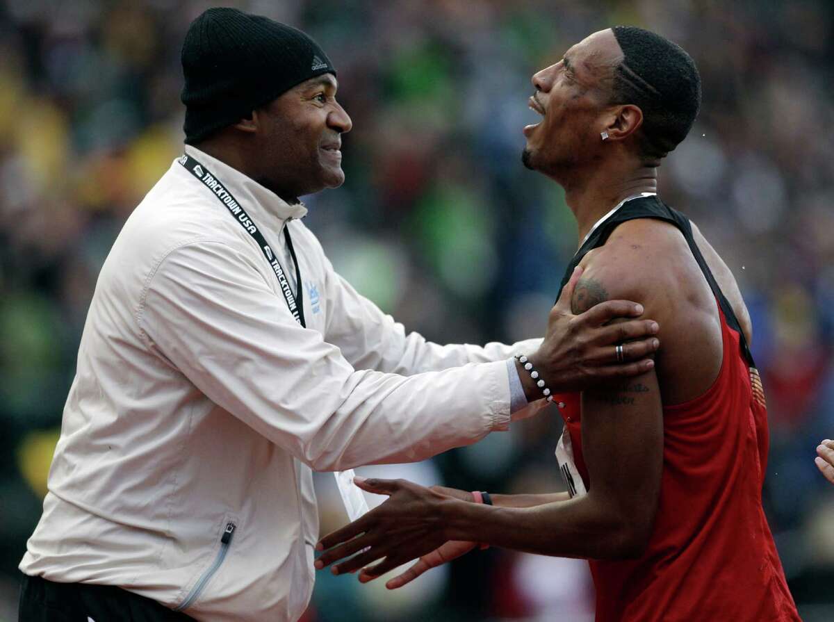 Duane Solomon Jr., is congratulated by former Olympian Johnny Gray after the men's 800m finals at the U.S. Olympic Track and Field Trials Monday, June 25, 2012, in Eugene, Ore. (AP Photo/Marcio Jose Sanchez)
